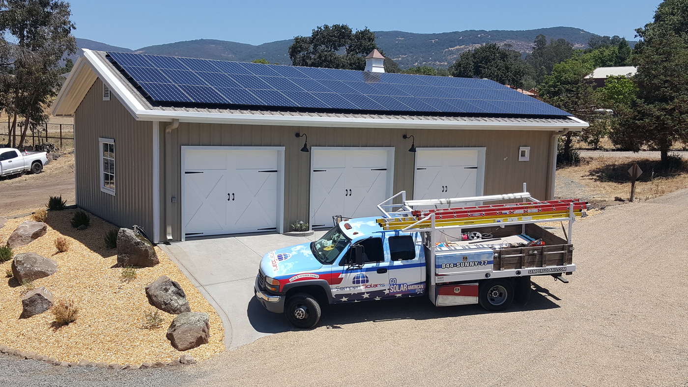 Solar panels on large garage shop installed by Semper Solaris the leading Solar company